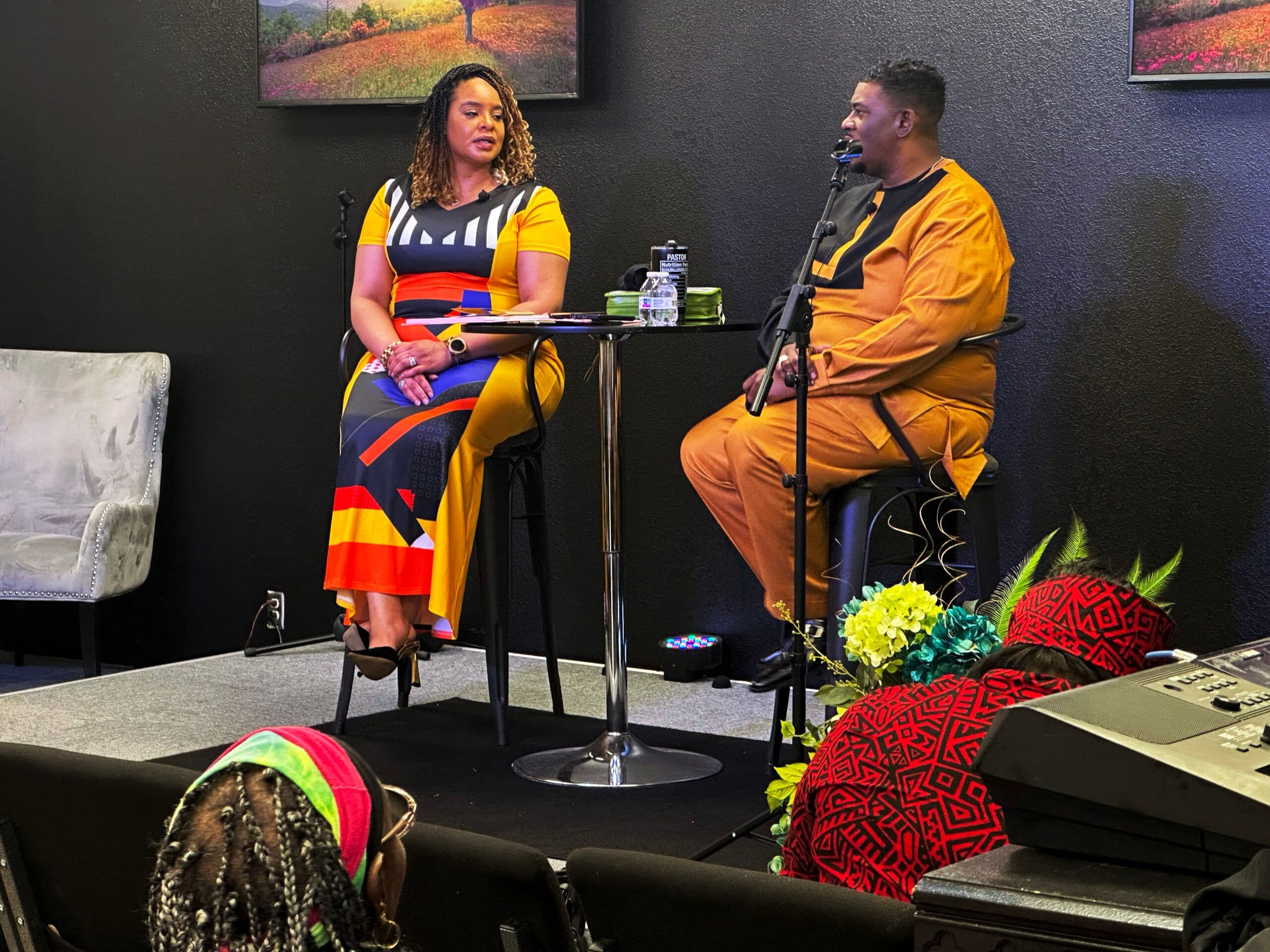 Two church leaders in conversation on stage during an FTCC gathering