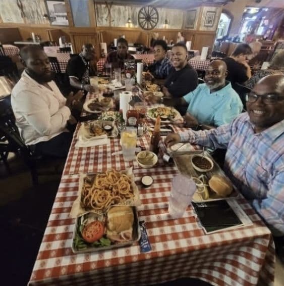 Men's ministry members sharing a meal together at a restaurant