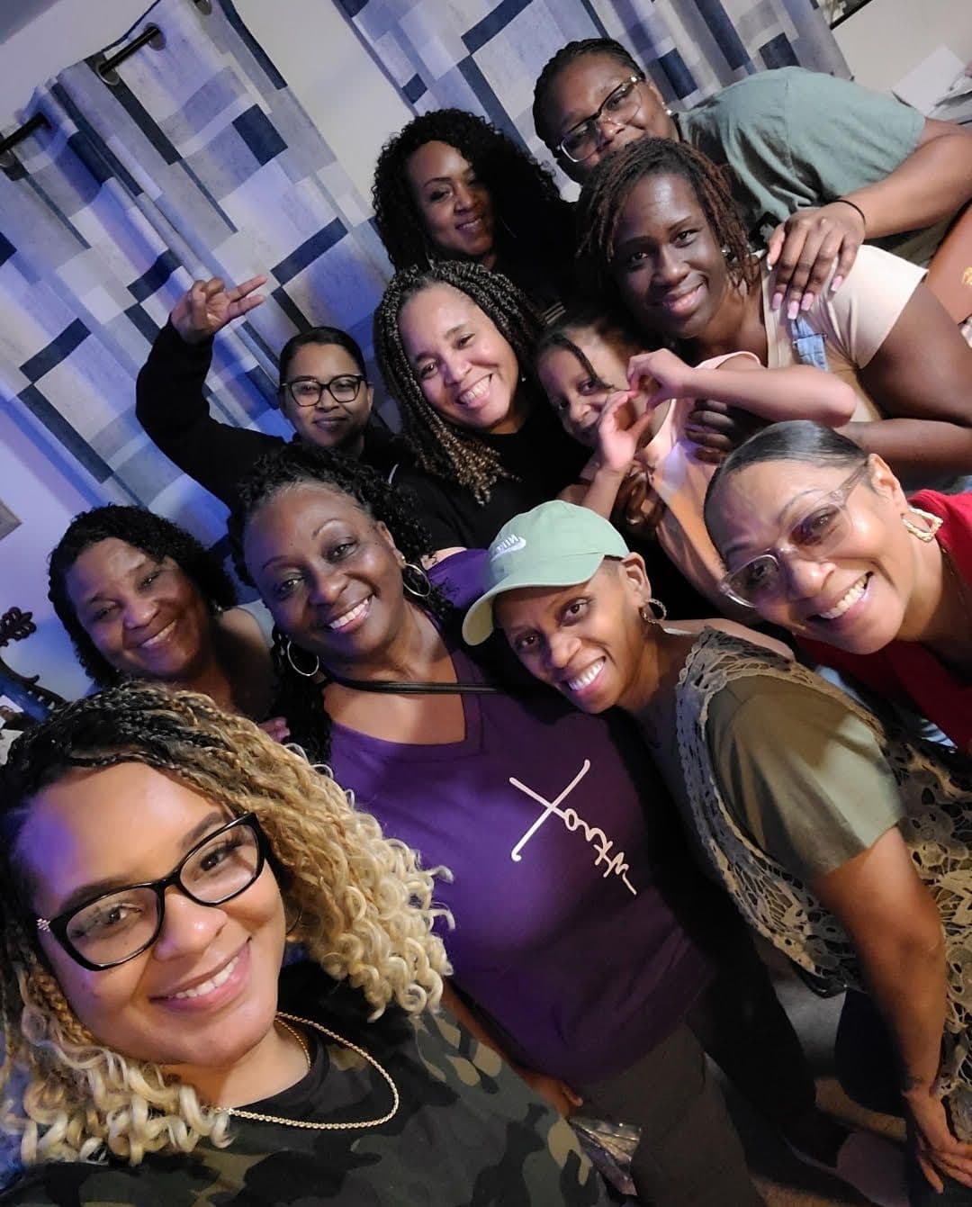 Smiling Sisters in Strength members taking a group selfie