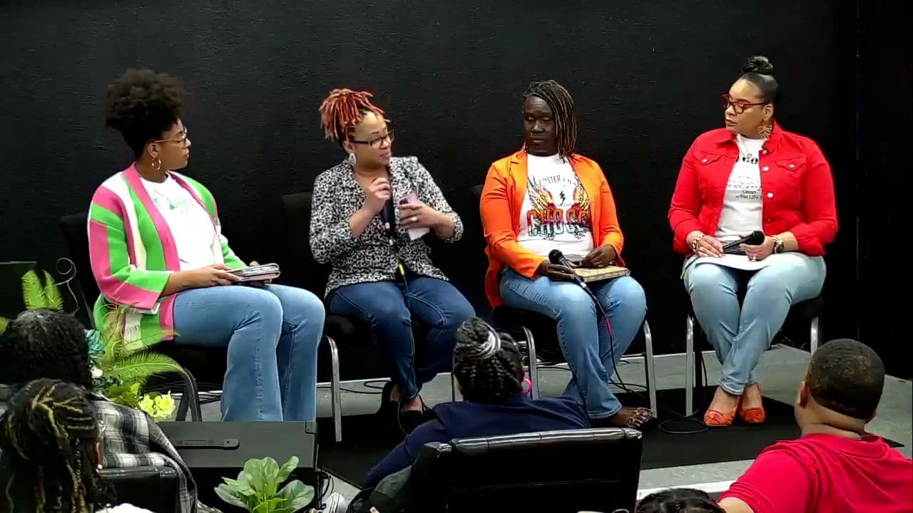 Four women sharing a panel conversation on stage at Faith Tabernacle Christian Church